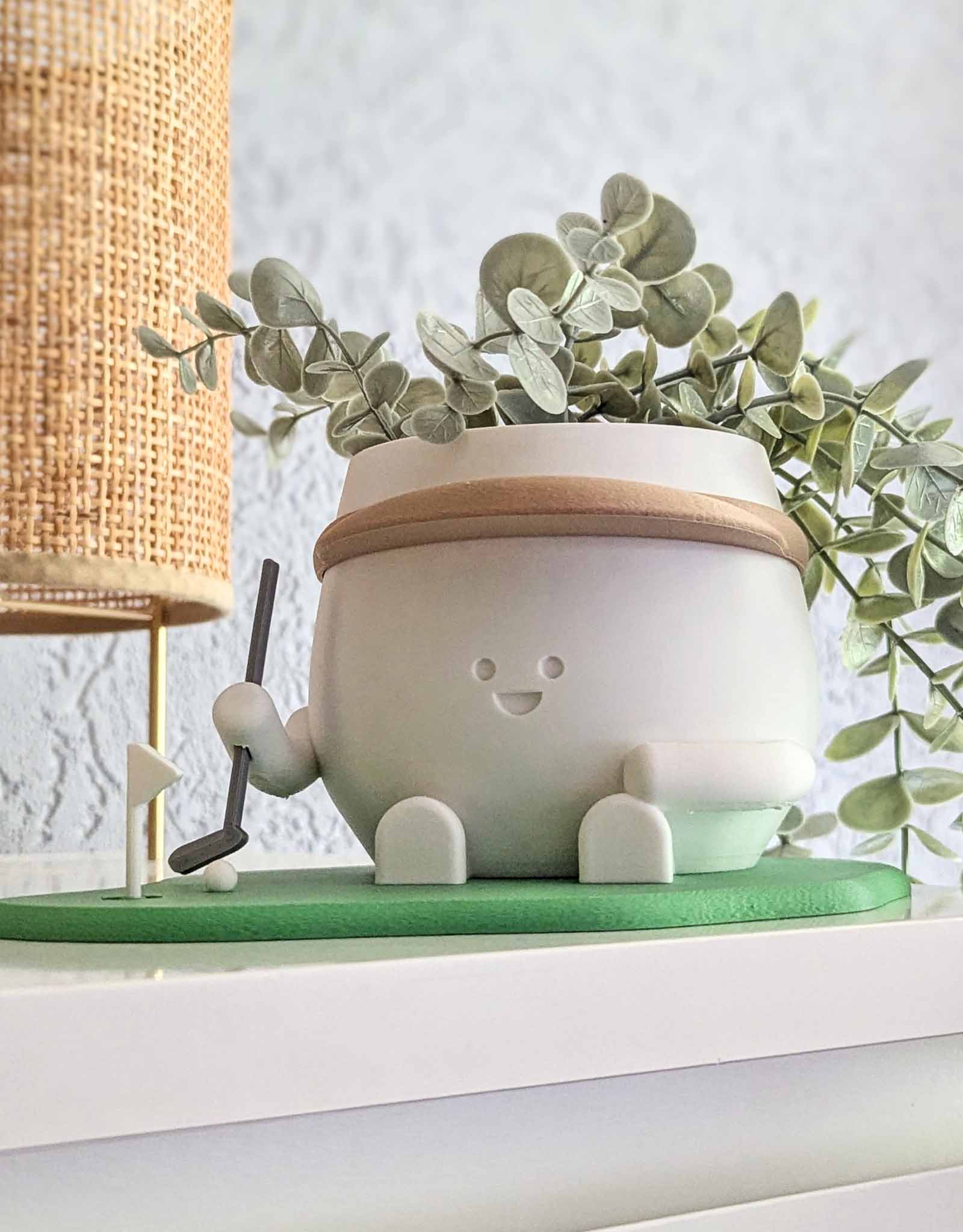 Happy golf player plant pot