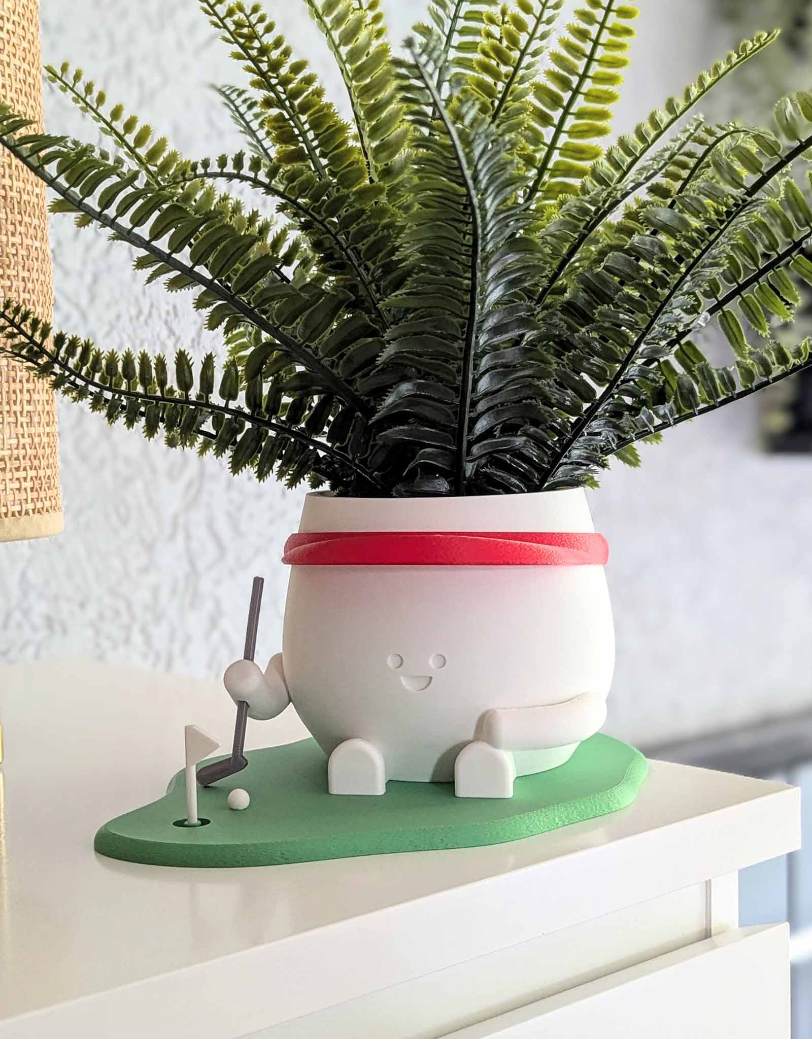 Happy golf player plant pot
