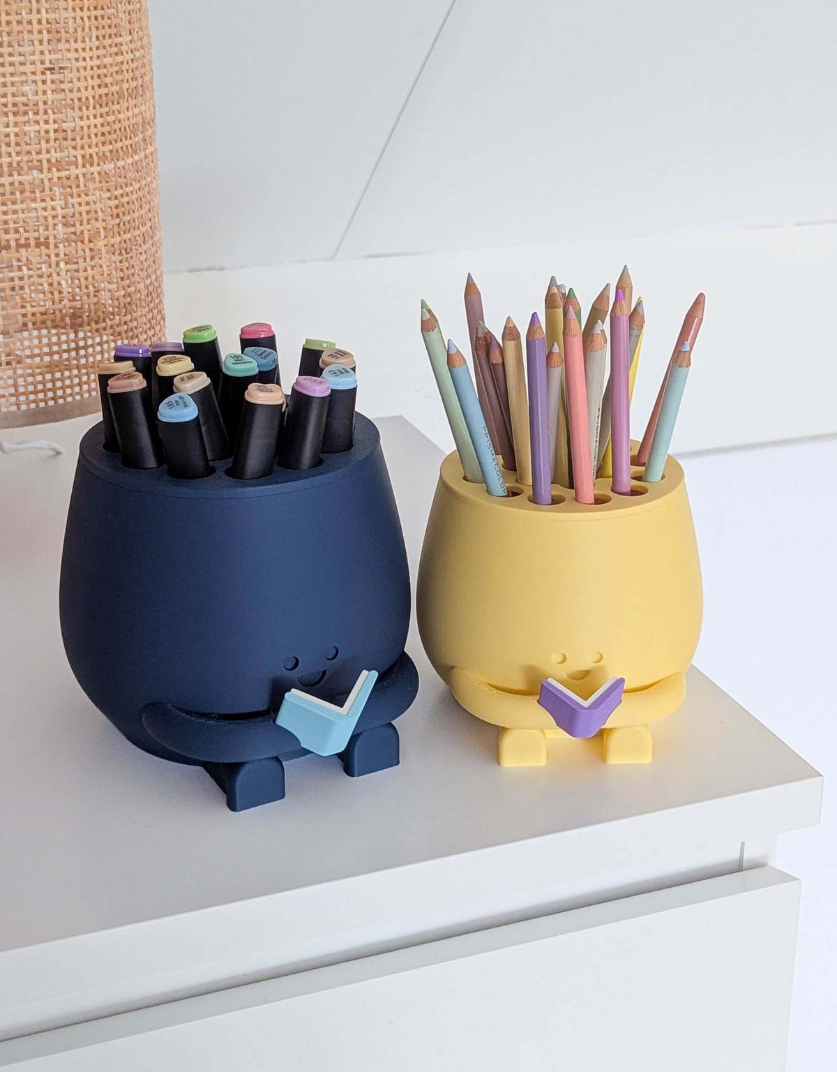 Happy pencil holder with a book