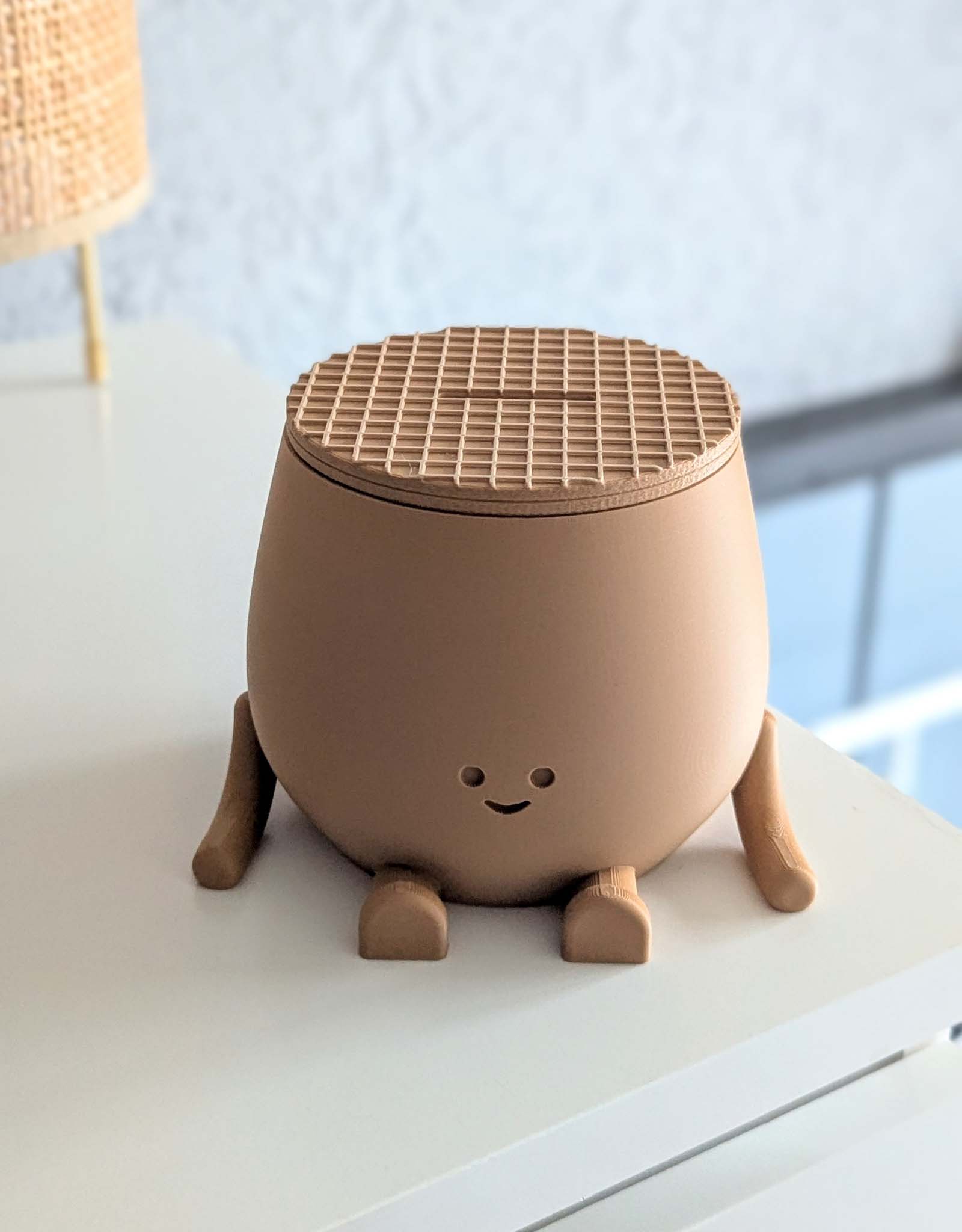 Piggy bank featuring an adorable smile and a lid designed to look just like a traditional stroopwafel, that famous Dutch treat everyone loves.
