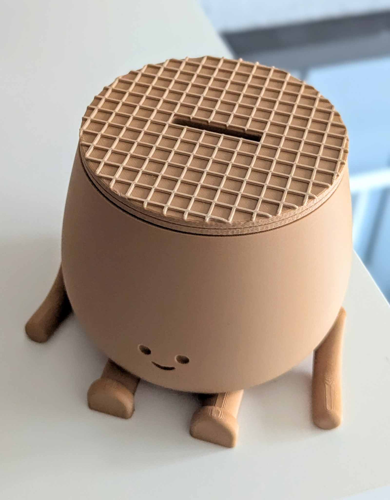 Piggy bank featuring an adorable smile and a lid designed to look just like a traditional stroopwafel, that famous Dutch treat everyone loves.