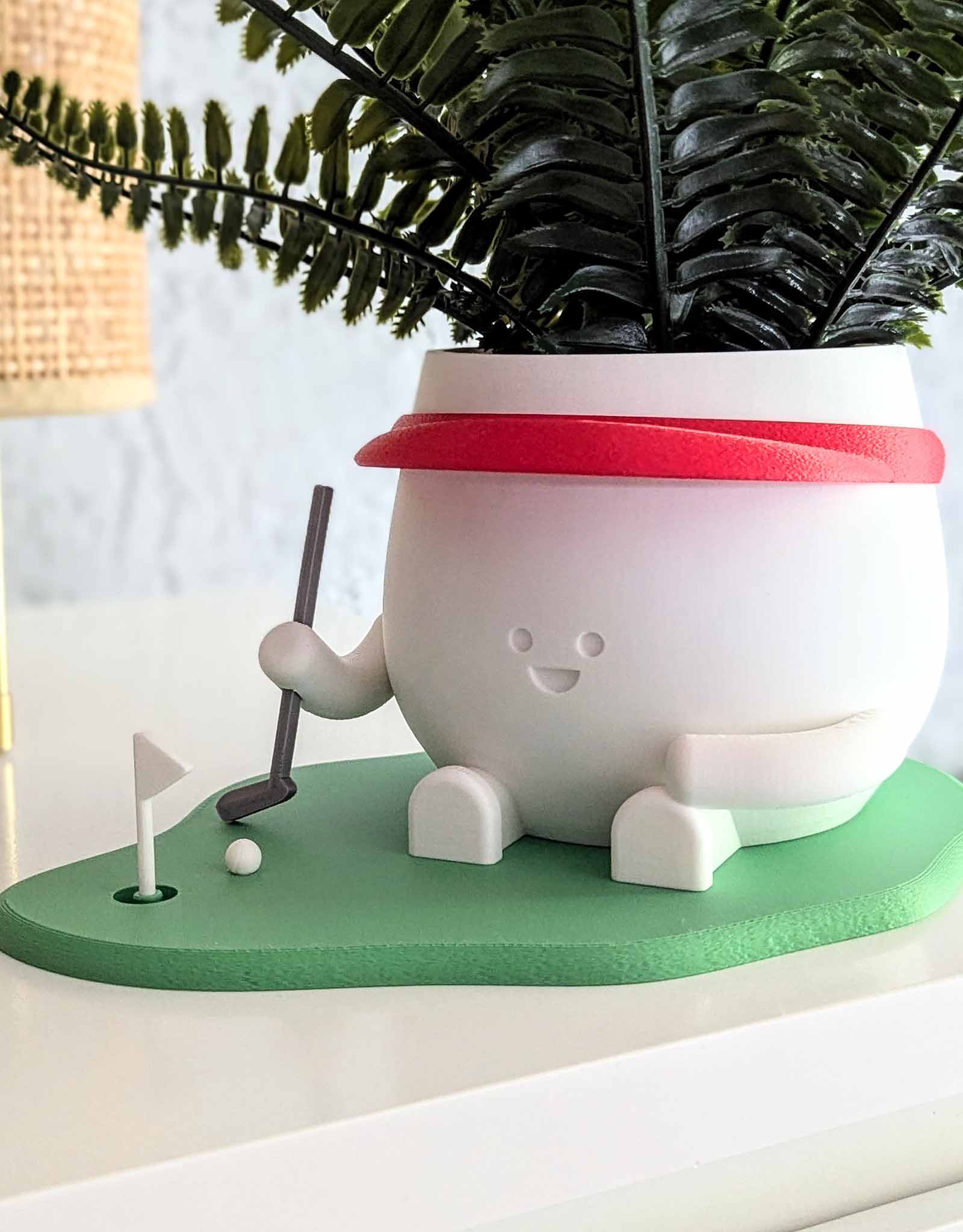 Happy golf player plant pot