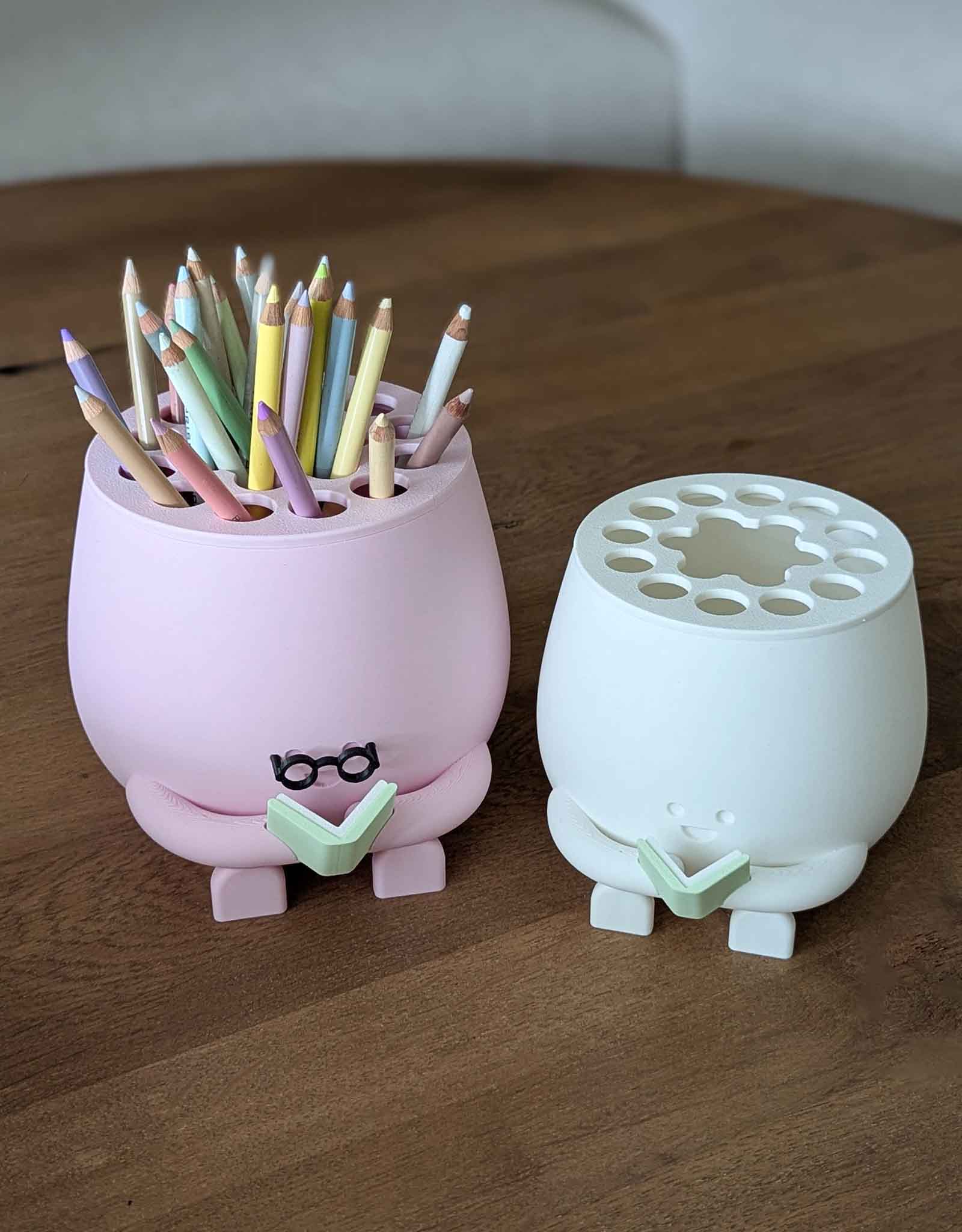 Happy pencil holder with a book