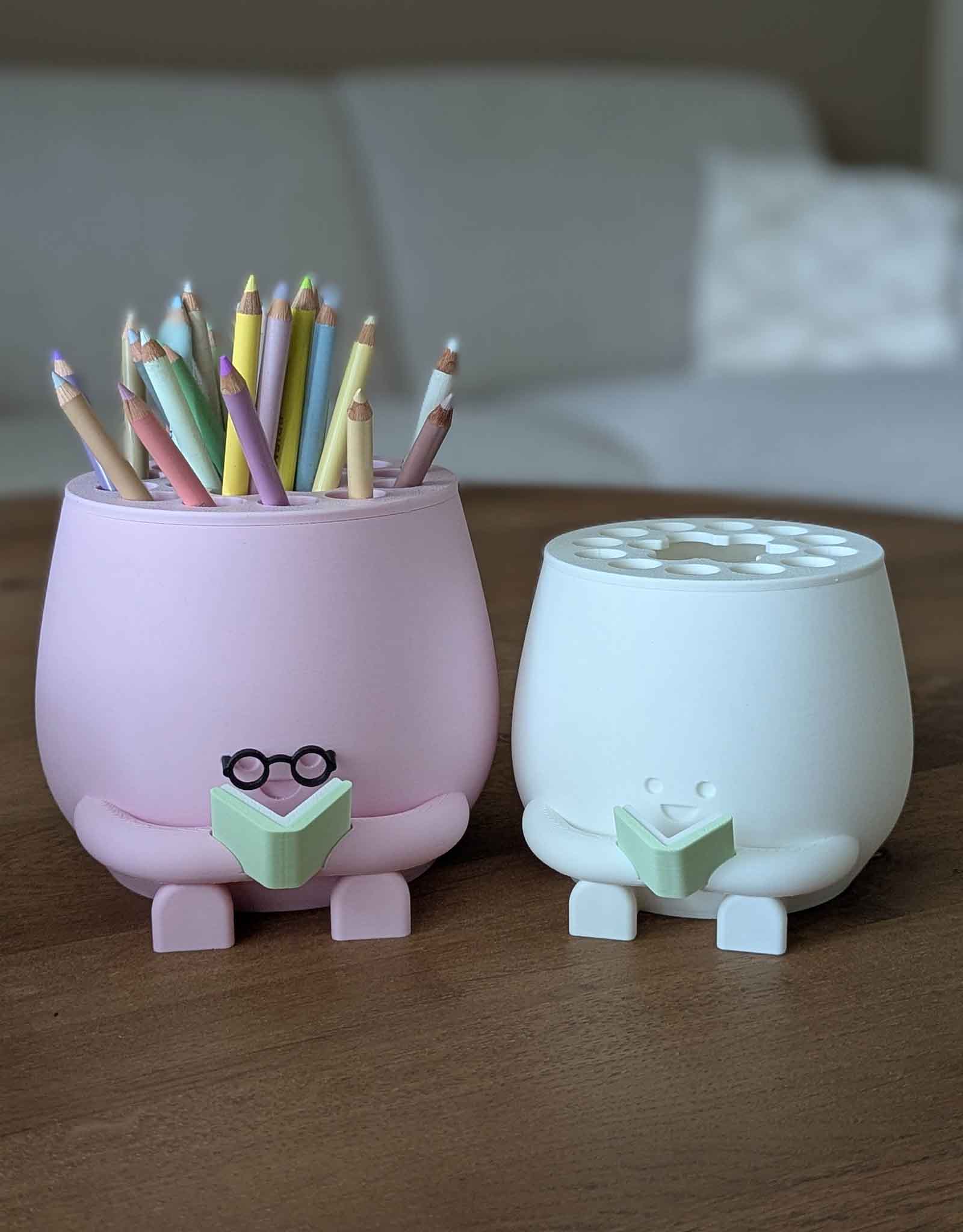Happy pencil holder with a book