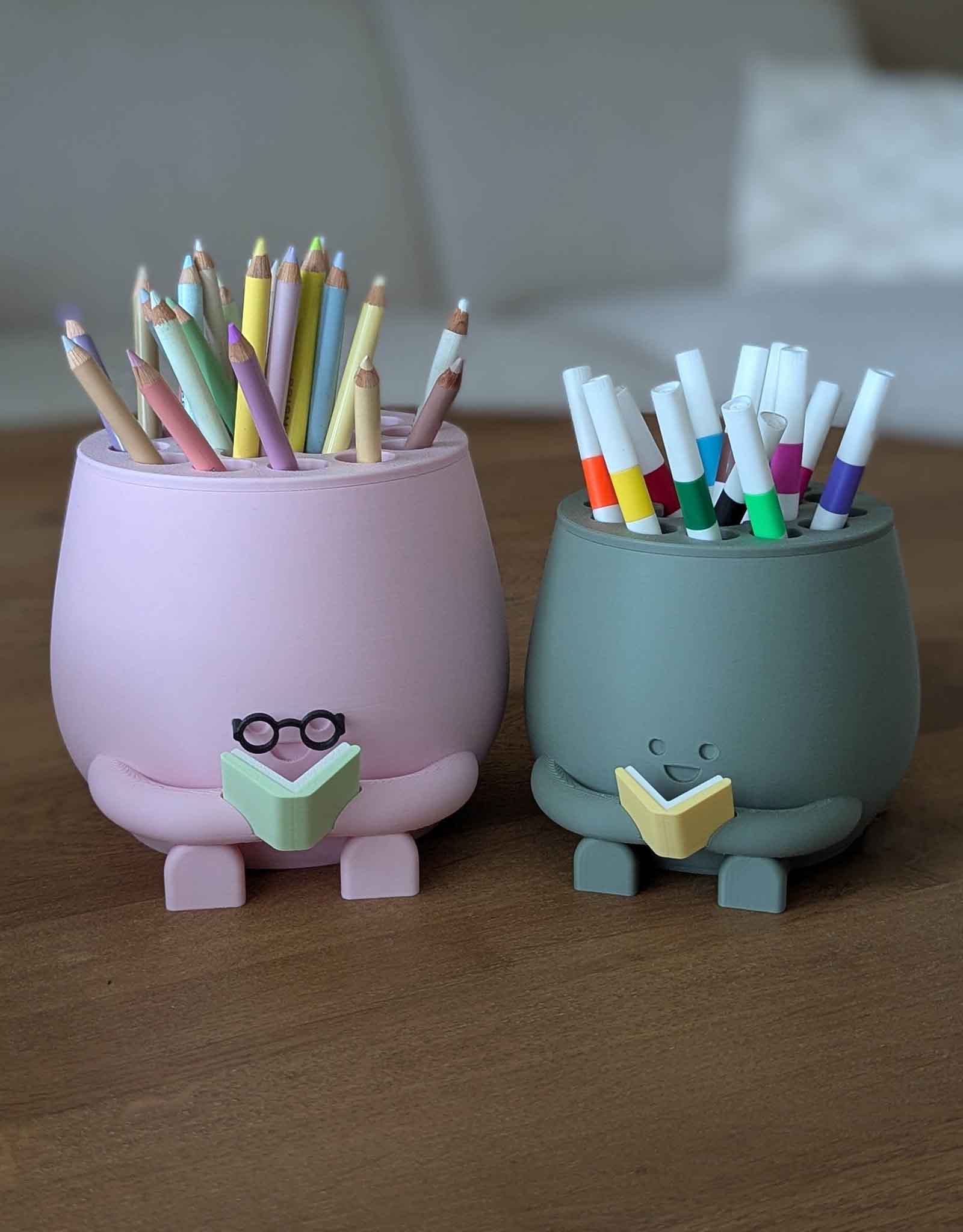 Happy pencil holder with a book