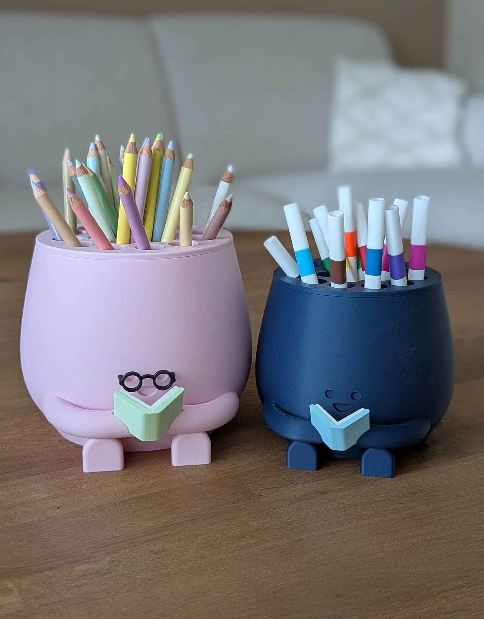 Happy pencil holder with a book