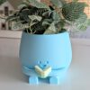 Plant pot reading a book